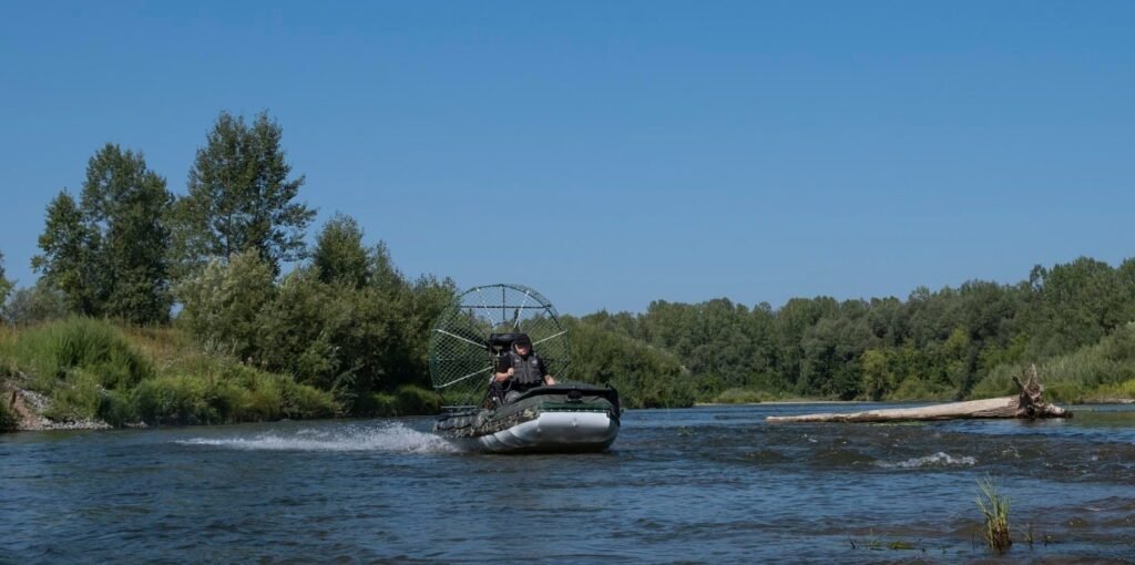 An image of a man riding his airboat in the Everglades National Park. 